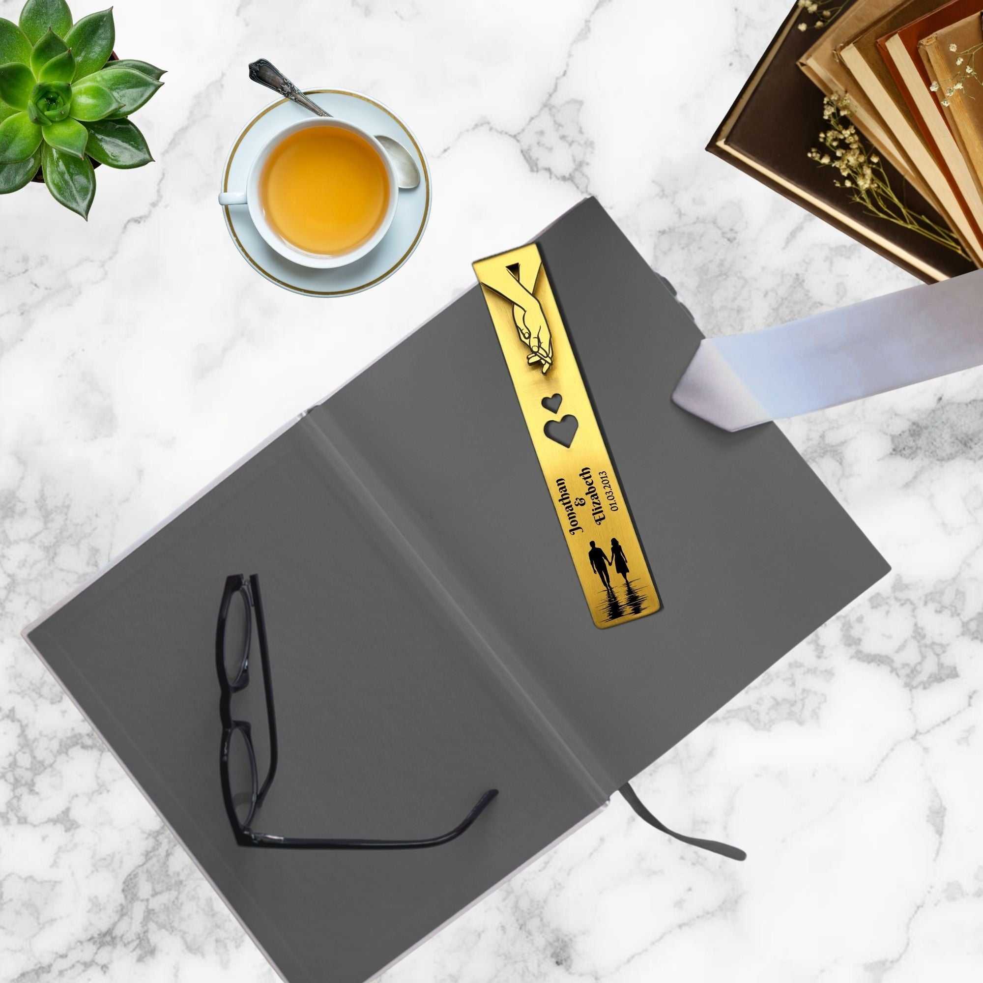 Personalised brass bookmark engraved with names and date, ideal 21st wedding anniversary gift in elegant gift box